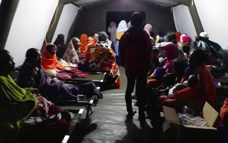 People affected by the earthquake rest at a temporary shelter in Lombok, Indonesia, Sunday, Aug. 5, 2018. A strong earthquake struck Indonesia's popular tourist island of Lombok on Sunday, triggering a tsunami warning, one week after another quake in the same area killed more than a dozen people. (AP Photo)