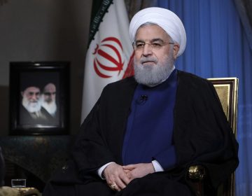 In this photo released by official website of the office of the Iranian Presidency, President Hassan Rouhani addresses the nation in a televised speech in Tehran, Iran, Monday Aug. 6, 2018. The U.S. is bracing for cyberattacks Tehran could launch in retaliation for sanctions President Donald Trump has slapped back on Iran, cybersecurity and intelligence experts warn (Iranian Presidency Office via AP)