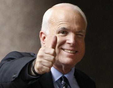 In this Sept. 28, 2008 file photo, Republican presidential candidate, Sen. John McCain, R-Ariz., gives a thumbs up as he arrives at his campaign headquarters in Arlington, Va.  McCain’s family says the Arizona senator has chosen to discontinue medical treatment for brain cancer.  (Gerald Herbert/AP Photo)