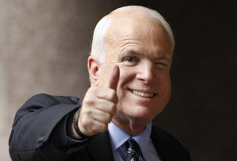 In this Sept. 28, 2008 file photo, Republican presidential candidate, Sen. John McCain, R-Ariz., gives a thumbs up as he arrives at his campaign headquarters in Arlington, Va.  McCain’s family says the Arizona senator has chosen to discontinue medical treatment for brain cancer.  (Gerald Herbert/AP Photo)