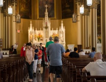 Parishioners receive communion at Holy Infancy Roman Catholic in Bethlehem, Pennsylvania, part of the Allentown Diocese. (Lindsay Lazarski/WHYY)