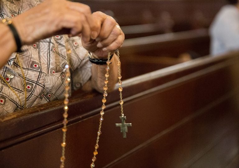 Parishioners pray the Rosary at Holy Infancy Roman Catholic in Bethlehem, Pennsylvania after mass on Tuesday, August 14, 2018, the same day, Pennsylvania Attorney General released his two-year grand jury investigation into widespread sexual abuse and cover-up within six Catholic dioceses across the state. (Lindsay Lazarski/WHYY)