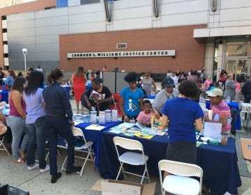 Community groups offer support and guidance outside the county courthouse in Wilmington as part of the launch of the community court concept. (Mark Eichmann/WHYY)