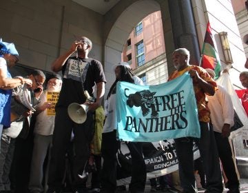 Supporters of Mumia Abu-Jamal, convicted in the 1981 murder of a Philadelphia police officer,  gather Thursday outside the Criminal Justice Center where a judge was considering whether Abu-Jamal’s appeals should be reinstated. (Emma Lee/WHYY)