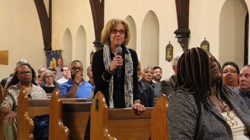 Audience members raise questions during a panel discussion on homelessness that followed a screening of the public television series, 