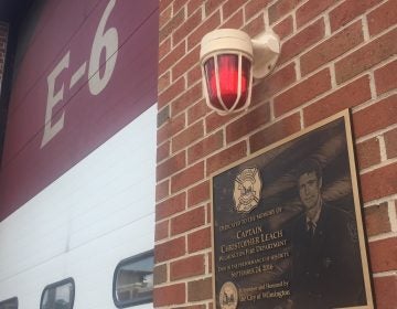 A plaque dedicated to Christopher Leach, one of three Wilmington firefighters killed in a September 2016 fire, is affixed to Station 6.. The term E6 refers to Engine 6, water-carrying truck that normally operates out of the station, but was mothballed the night the trio died 
while battling the blaze. (Cris Barrish/WHYY)