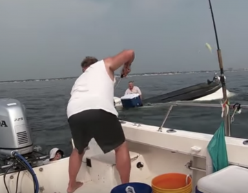 Gary Szabo rescues an angler from a capsized boat off Monmouth County on Thursday.