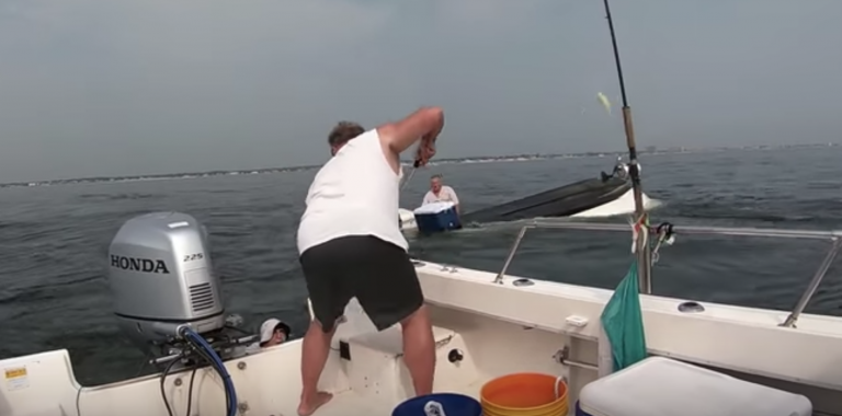 Gary Szabo rescues an angler from a capsized boat off Monmouth County on Thursday.