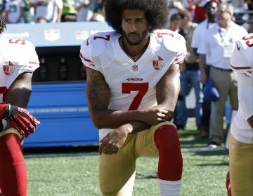 San Francisco 49ers' Colin Kaepernick kneels during the national anthem before an NFL football game against the Seattle Seahawks, in Seattle, in September 2016. (Ted S. Warren/AP)