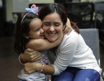 Natalia Oliveira da Silva and her daughter, Sara, 5, hug at a Catholic Charities facility in San Antonio, TX. They were separated in late May. (Eric Gay/AP)