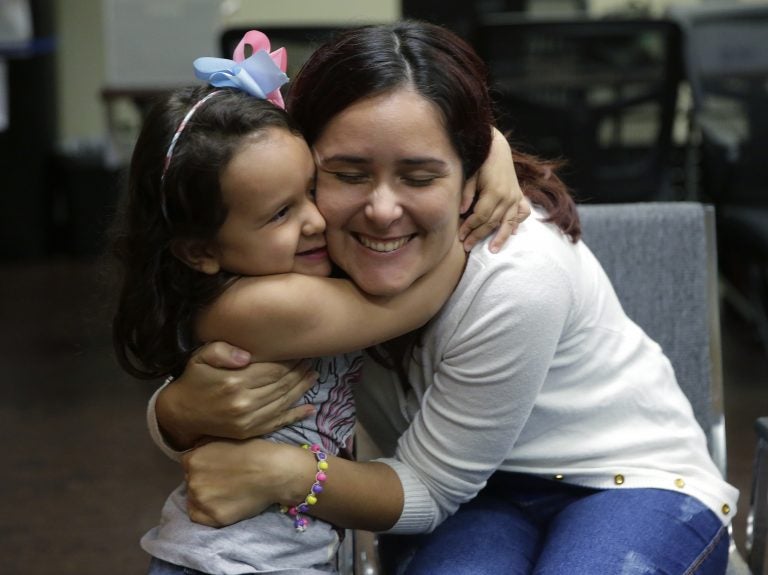 Natalia Oliveira da Silva and her daughter, Sara, 5, hug at a Catholic Charities facility in San Antonio, TX. They were separated in late May. (Eric Gay/AP)
