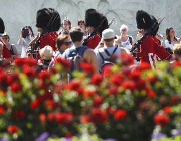 Spectators gather daily to watch the changing of the guard at Buckingham Palace in London. On Friday, a military band paid tribute to Aretha Franklin at the ceremony.
(Kirsty O'Connor/AP)