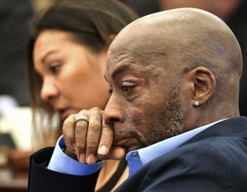 Plaintiff Dewayne Johnson, shown on July 9, listening to his attorney speak about his condition during the Monsanto trial in San Francisco. On Friday, a jury awarded Johnson $289 million in damages after ruling that Monsanto intentionally concealed the health risks of its popular Roundup products. (Josh Edelson/AP)