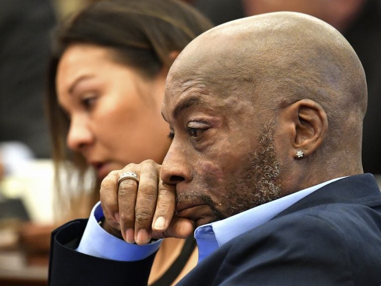 Plaintiff Dewayne Johnson, shown on July 9, listening to his attorney speak about his condition during the Monsanto trial in San Francisco. On Friday, a jury awarded Johnson $289 million in damages after ruling that Monsanto intentionally concealed the health risks of its popular Roundup products. (Josh Edelson/AP)