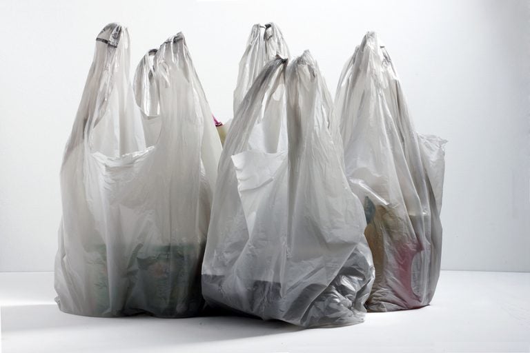 Multiple plastic shopping bags on table top (Big Stock)