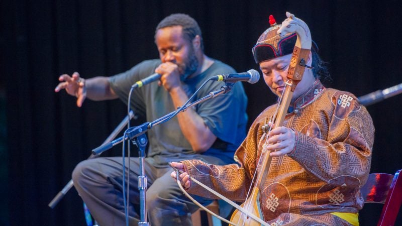 The Tuvan throat singing group Alash was joined by Baltimore based beat boxer Shodekeh, left, for the Saturday evening concert. (Jonathan Wilson for WHYY)