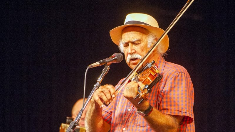 Michael Doucet fronts the band BeauSoleil during the Saturday evening concert. (Jonathan Wilson for WHYY)