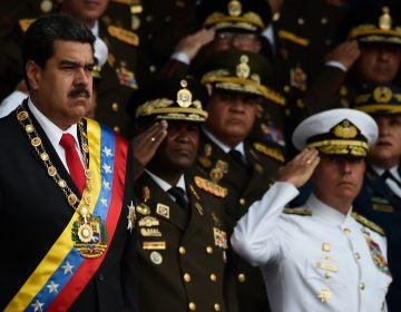 Venezuelan President Nicolas Maduro, left, survived an 