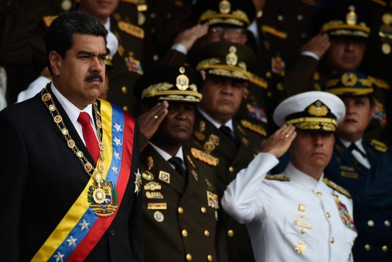 Venezuelan President Nicolas Maduro, left, survived an 