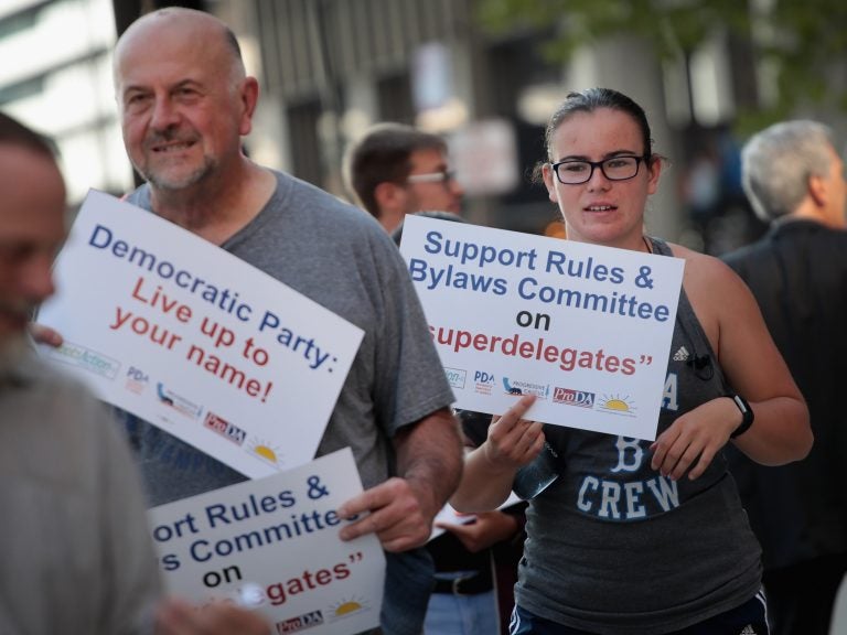 Demonstrators gather outside the Democratic National Committee's summer meeting to protest the use of 