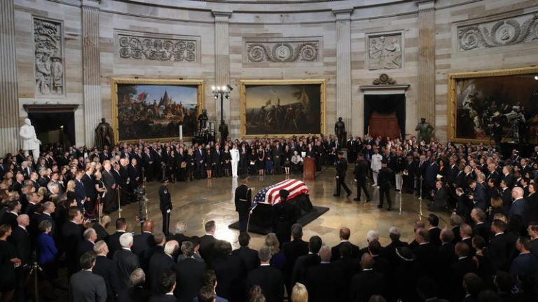 The flag-draped casket of Sen. John McCain arrives inside the Rotunda of the U.S. Capitol on Friday. (Drew Angerer/Getty Images)
