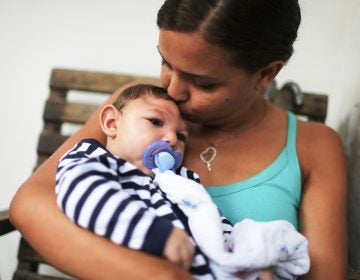 Mother Daniele Santos holds her baby Juan Pedro, who has microcephaly, on May 30, 2016 in Recife, Brazil. Researchers are now learning that Zika's effects can appear up to a year after birth.
(Mario Tama/Getty Images)