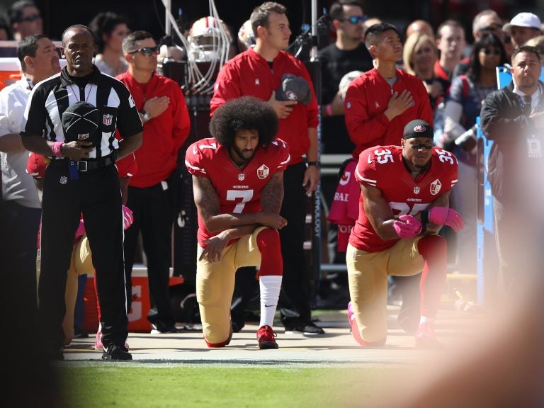 Colin Kaepernick, seen kneeling beside teammate Eric Reid during the national anthem before a game in 2016, catalyzed a series of protests against police brutality that continue to roil the NFL. Colin Kaepernick, seen kneeling beside teammate Eric Reid during the national anthem before a game in 2016, catalyzed a series of protests against police brutality that continue to roil the NFL. (Ezra Shaw/Getty Images)