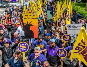 Cashiers, cooks, delivery people, fast-food workers and their supporters rallied outside New York City Hall in 2017. Their influential union, the Service Employees International Union, also includes about half a million home health aides. (Pacific Press/LightRocket/Getty Images)