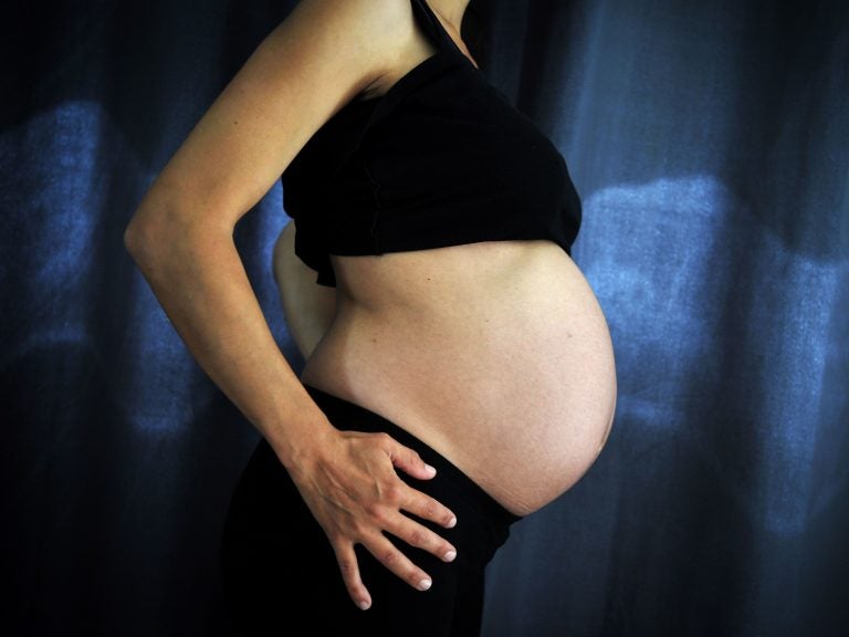 Inducing labor at 39 weeks may involve IV medications and continuous fetal monitoring. But if the pregnancy is otherwise uncomplicated, mother and baby can do just fine, the latest evidence suggests. (Loic Venance/AFP/Getty Images)