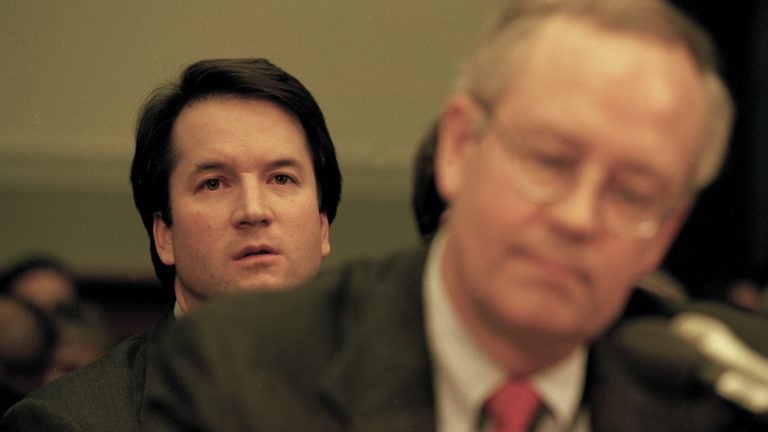 Brett Kavanaugh sits behind independent counsel Kenneth Starr as Starr testifies before the House Judiciary Committee on the possibility of former President Bill Clinton's impeachment in 1998.