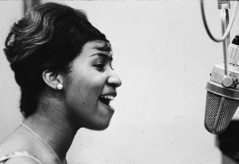 Aretha Franklin sings in the studio during during her early career at Columbia Records. (Frank Driggs Collection/Getty Images)