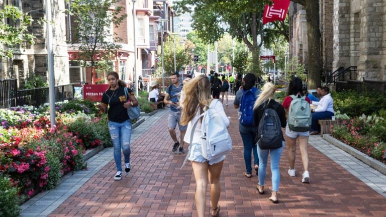 Students walk on the Temple University campus in Philadelphia. Temple has started a master’s degree in sport business, among the 41,446 degree or certificate programs colleges and universities have added since 2012. (Matt Rourke/The Associated Press)