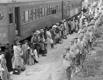 People of Japanese ancestry arrive at the assembly center at Santa Anita Racetrack in Arcadia, Calif., in 1942 for internment. (National Archives and Records Administration)