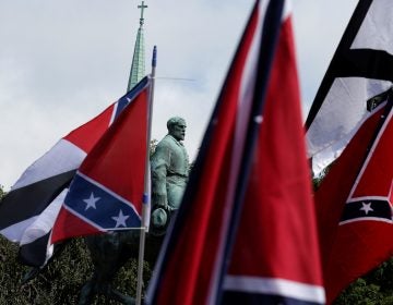 Members of white nationalist groups gathered around a statue of Robert E. Lee during a rally in Charlottesville, Va., on Aug. 12, 2017. (Joshua Roberts/Reuters)