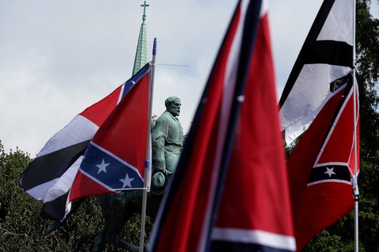 Members of white nationalist groups gathered around a statue of Robert E. Lee during a rally in Charlottesville, Va., on Aug. 12, 2017. (Joshua Roberts/Reuters)