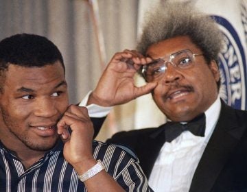 Mike Tyson, left, stands with fight promoter Don King during a news conference on Wednesday, June 25, 1987. (AP Photo/Paul Burnett)