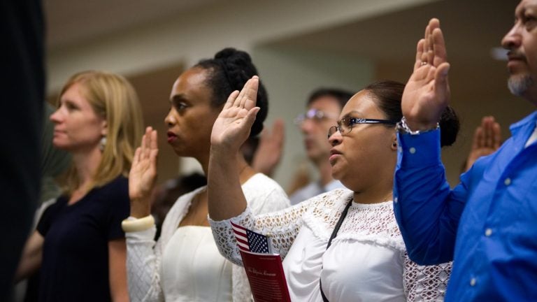 A naturalization ceremony takes place at the U.S. Citizenship and Immigration Service in Philadelphia. (Bastiaan Slabbers for WHYY, file)