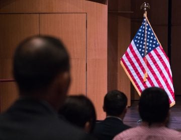 Newly sworn-in U.S. citizens gather for a naturalization ceremony in Alexandria, Va., in August. A potential trial over a new 2020 census citizenship question is set to start on Nov. 5 in New York City. (Claire Harbage/NPR)