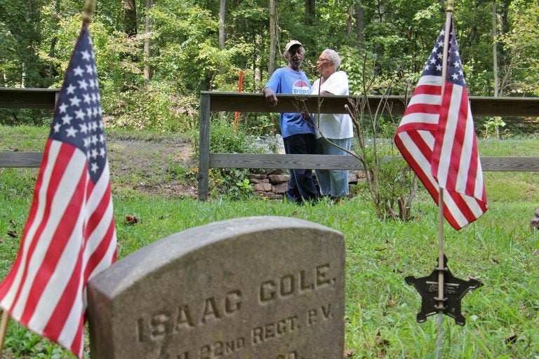 John Cole and his wife, Barbara, visit the tiny graveyard where his great grandfather Isaac Cole, is buried. Isaac Cole was a Civil War veteran and worked as a woodsman for the nearby Hopewell Furnace.