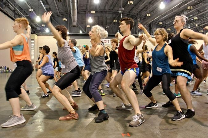 Volunteer dancers rehearse for their perfomance of 