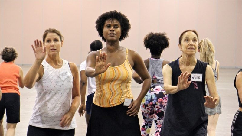 Volunteer dancers rehearse for 