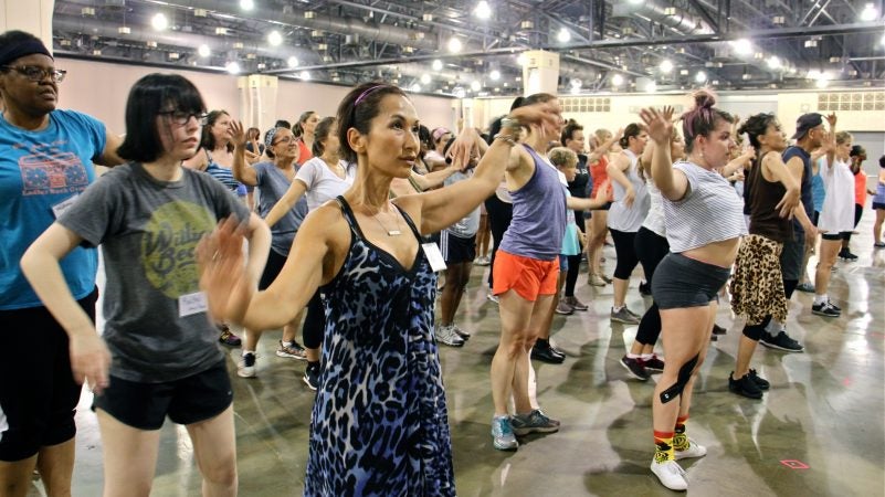 Volunteer dancers rehearse for 