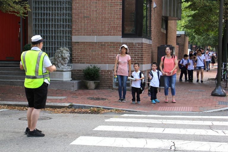 Students from McCall School in South Philadelphia walk home on Sept. 6, 2018. (Emma Lee/WHYY)