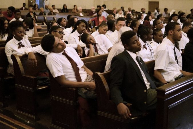 Students attempt to listen to the speakers as the temperature in the chapel rises, during the “Opening the Gates” forum, on Tuesday at Girard College. (Bastiaan Slabbers for WHYY)