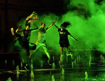 Temple Students Olivia Chiaravalli, Shandler McNelis, and Alyssa Eder jump as the mist rolls past at the site-specific art installation titled 