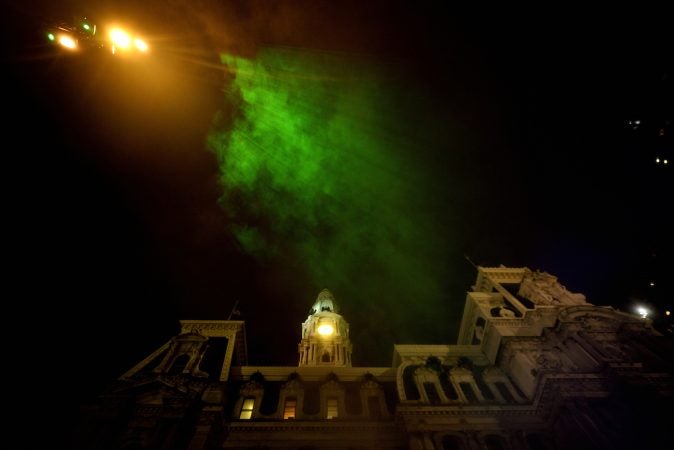 Mist catches green rays of light as it billows up towards the sky during the public unveiling of the first section of the site-specific art installation titled 