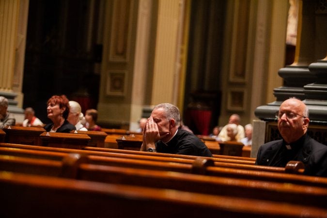 Clergy attended a mass in September 2018 at the Basillica of Saints Peter and Paul for a night of prayer and reflection following revelations of wide spread sexual abuse by priests across the state. (Brad Larrison for WHYY)