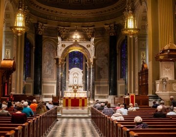 Philadelphia area catholics attended a mass Friday evening at the Basillica of Saints Peter and Paul for a night of prayer and reflection following the recent revelations of wide spread sexual abuse by priests across the state. (Brad Larrison for WHYY)