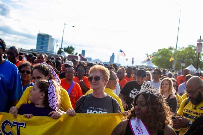 Participants in the the 2018 Philadelphia Recovery walk begin the march through Old City Saturday morning at Penn's Landing. (Brad Larrison for WHYY)