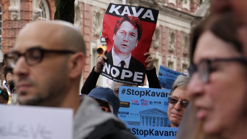 About 200 protesters gather outside the United States Custom House at 200 Chestnut Street to voice their objections to Brett Kavanaugh as a nominee for the U.S. Supreme Court in light of sexual assault allegations. (Emma Lee/WHYY)